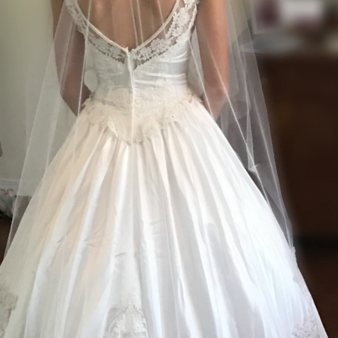 image of back of redesigned wedding dress, strapless and open back design