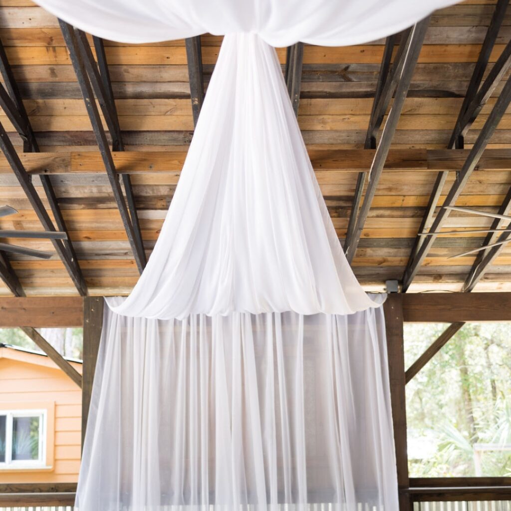 image of white 4pt. Draping overhead plus sweetheart table backdrop