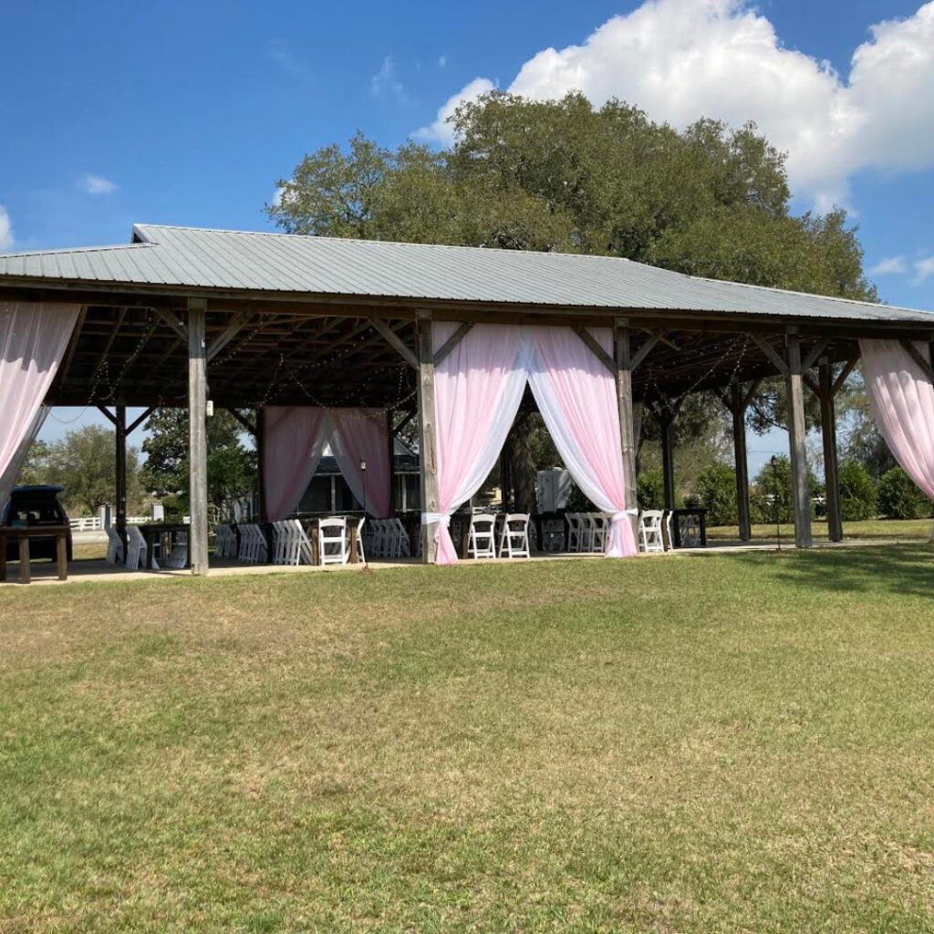 Image of pavilion at Bramble Tree Estates draped in white and pink "Bramble Tree Special"